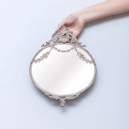 Détail de Miroir mural rond métal, décoration intérieure élégante