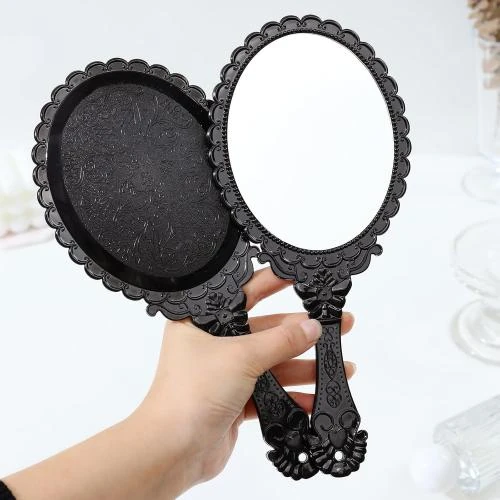 Zoom sur Miroir à main vintage noir, ovale, maquillage voyage